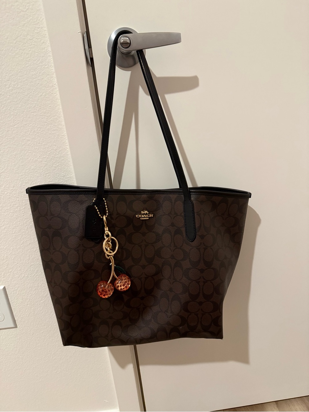 Coach Brown Logo Canvas Tote with Black Straps and Cherry Charm